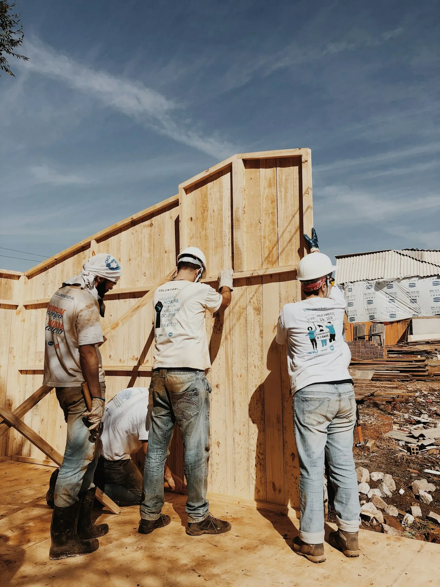 Builders in hard hats on an active construction site