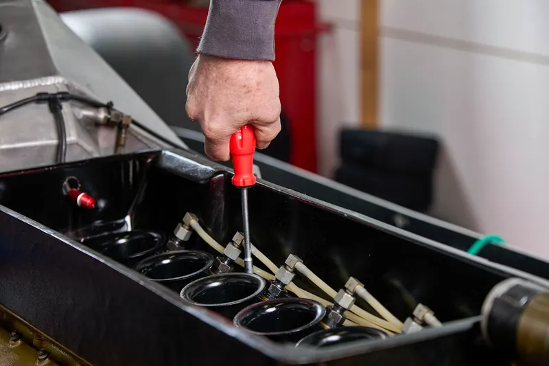 Mechanic repairing a car engine